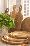 Wooden cutting boards and kitchen utensils